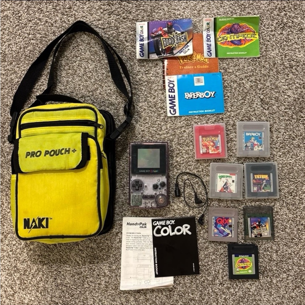 Atomic Purple gameboy color with 7 games in good working condition
